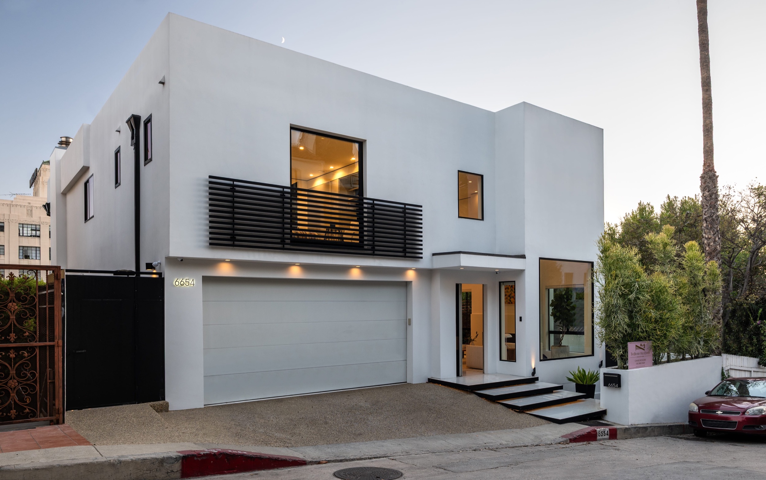 Front elevation in daylight with the garage and entry