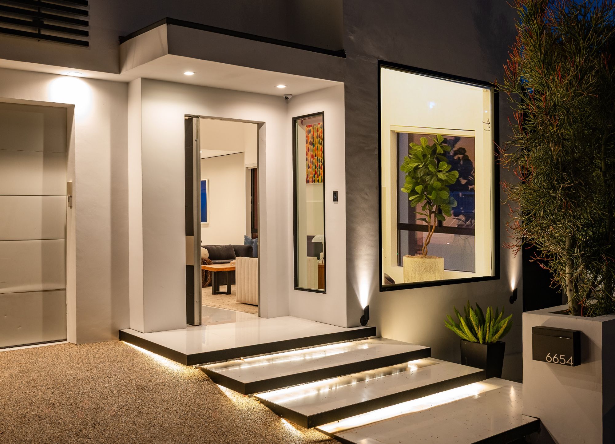 Front entrance at night with the entry lit