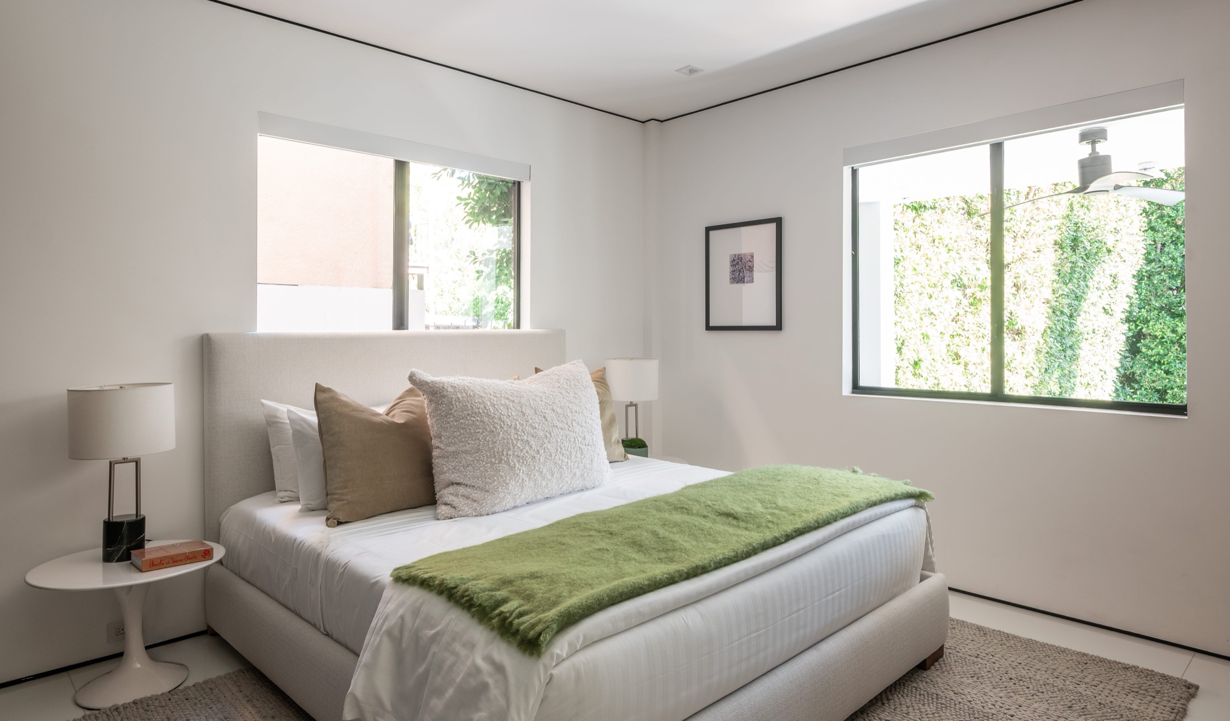 Garden bedroom at pool level, the larger of the two, with windows to the hedge