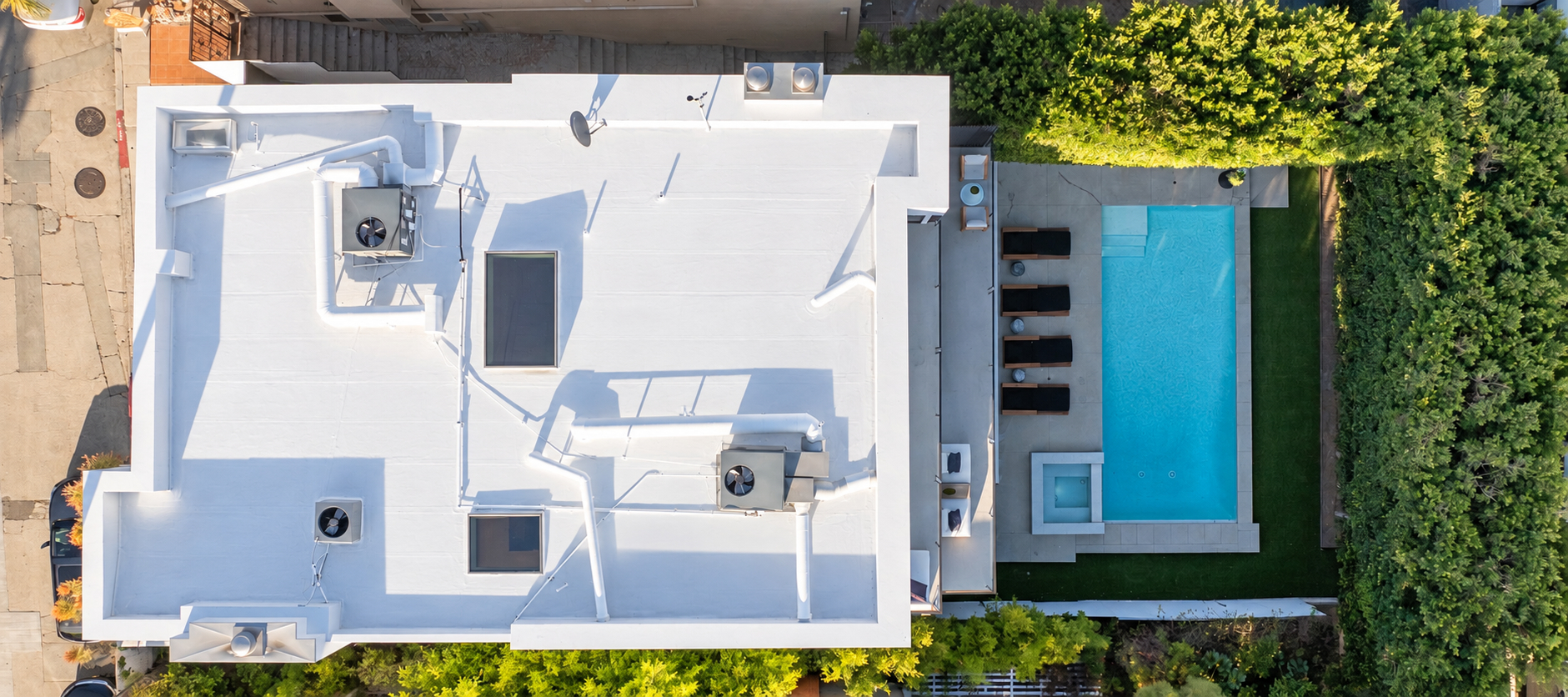 Overhead aerial showing the roof, terraces, pool and spa on the lot